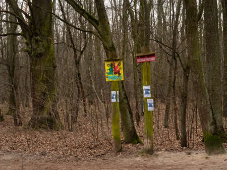 Warsaw/Poland - 29/03/2020. The path in Kabacki forest with information about keeping distance due to coronavirus pandemicのeditorial素材