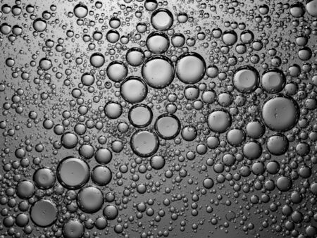 Abstract bubble background in grey. Slightly blurred and selective focus.の写真素材
