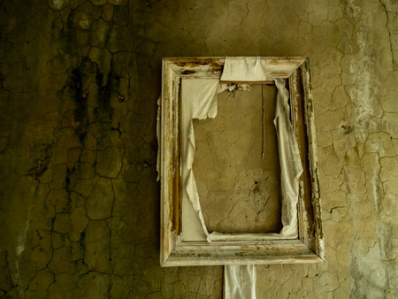 Empty frame on destroyed wall in Pripyat near Chernobyl, Ukraine.