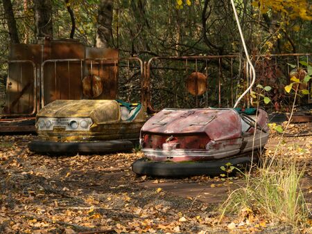 Bumper cars in abandoned amusement park in Pripyat, Chernobyl Exclusion Zone in autumn. Ukraineの写真素材
