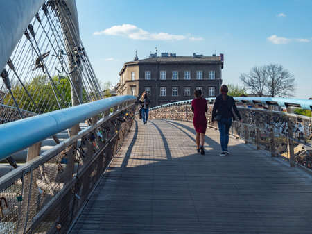 Cracow/Poland - 27/04/2020. People walking on Bernatek footbridge over Vistula river.のeditorial素材