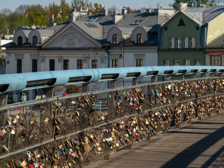 Cracow/Poland - 27/04/2020. The Bernatka footbridge - bridge of love with love padlocks in Krakow, Poland.のeditorial素材