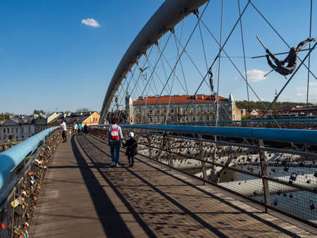 Cracow/Poland - 27/04/2020. People walking on Bernatek footbridge over Vistula river.のeditorial素材