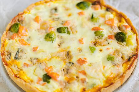 smoked salmon, Brussels sprouts and gorgonzola quiche tart, top viewの写真素材