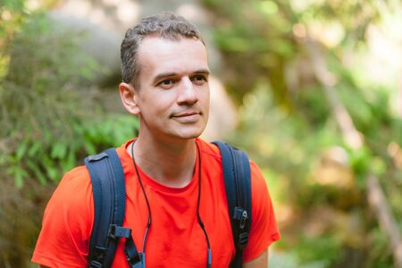 Young male hiker with backpack. Active healthy lifestyle adventure journey vacationsの写真素材