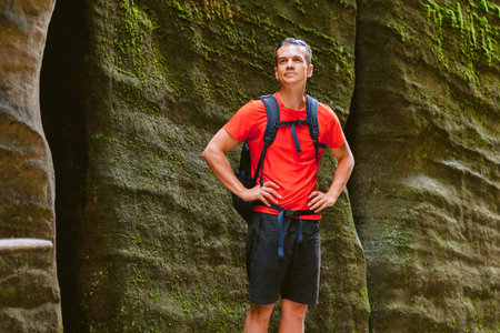 Young male hiker with backpack. Active healthy lifestyle adventure journey vacations