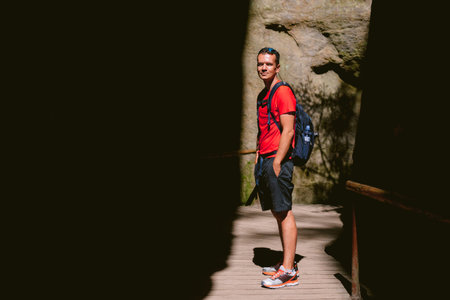 Young male hiker with backpack. Active healthy lifestyle adventure journey vacations. photo with...