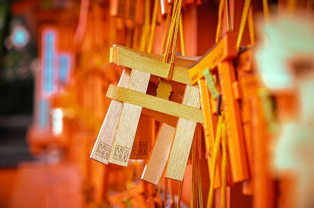 MINI WOODEN TORII AT FUSHIMI INARI TAISHA SHRINE, KYOTO, JAPAN : Small pieces of wood battens made up into traditional Japanese gate shape with blank surfaces on both front and back sides so that prayers could write their wishes on it.のeditorial素材