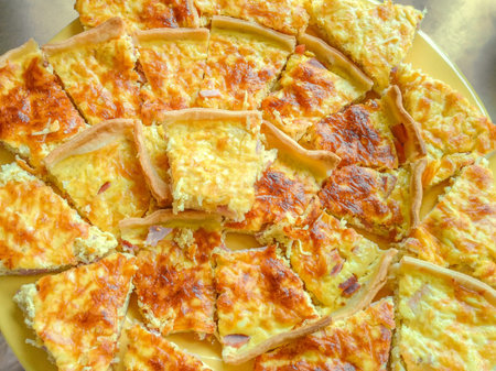 Quiche Lorraine - traditional French pie. Custard filled with bacon and top with cheese, baked in a pie crust.の写真素材