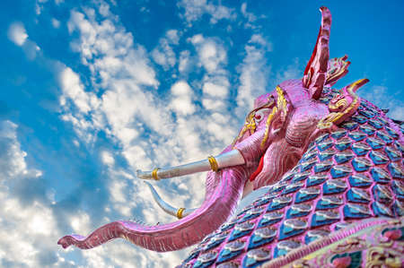 Mythological giant elephant statue. Colorful and intricate details of elephant-like statue is commonly seen in every temple in northern region of Thailand.の写真素材