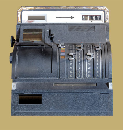 Old German cash registry on isolated dull yellow backgroundの写真素材