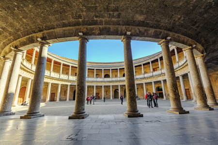 Granada, Spain - January 7, 2020: View of enclosed circular courtyard at the Palace of Charles V at Alhambra complex. A renaissance palace with Doric and Ionic orders at the lower and upper levels.のeditorial素材