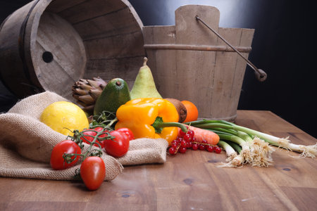Fresh fruits and vegetables for healthy in wooden bucketの写真素材