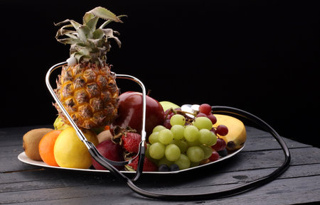 Healthy food in heart and cholesterol diet concept on vintage boardsの写真素材