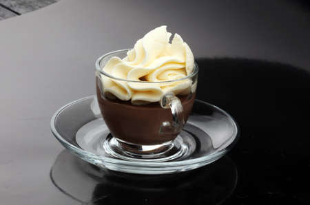 Hot chocolate cocoa with whipped cream on vintage wooden background, selective focusの写真素材
