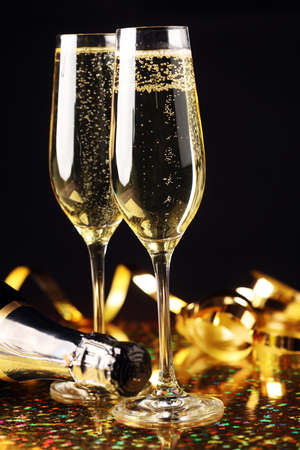 Conceptual Golden Brown Wine on Elegant Glass with Spiral Thin Wrapping Foils or Laces Decoration, on Abstract Brown Background - Champagne sylvester partyの写真素材