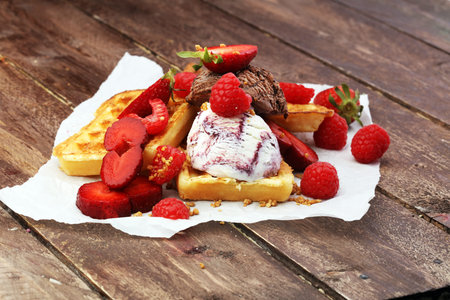 belgian waffles with ice cream, caramel sauceの写真素材