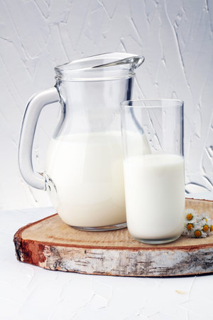 Milk jug and glass milk - healthy lifestyle conceptの写真素材
