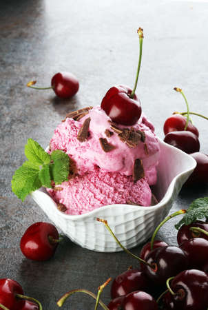 Cherry basket / Sweet cherry background/ cherry with leaf on greyの写真素材