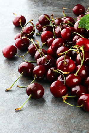 Cherry basket / Sweet cherry background/ cherry with leaf on grey