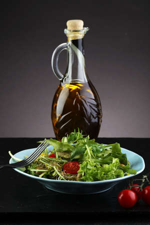 Bowl of salad on wooden tableの写真素材
