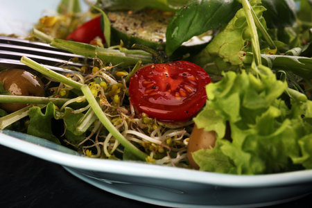 Bowl of salad on wooden tableの写真素材