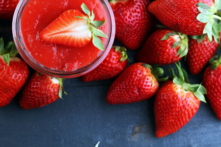 Fresh and healthy strawberry smoothie on wooden table