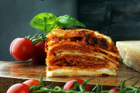 Serving of spicy traditional Italian beef lasagne in a restaurant - bolognese sauceの写真素材