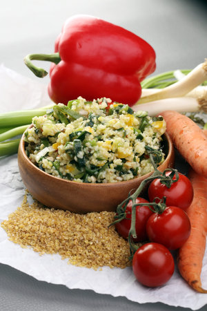 Tabbouleh salad with bulgur, parsley and vegetables -diet concept