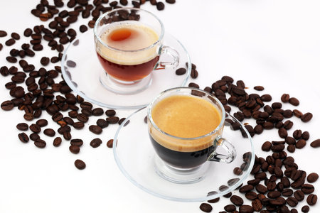 Coffee cup and beans on a white background.の写真素材