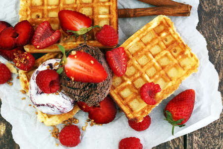 belgian waffles with ice cream, caramel sauceの写真素材