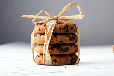 Chocolate cookies on white background with chocolate morselsの写真素材