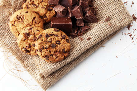 Chocolate cookies on white background with chocolate morselsの写真素材