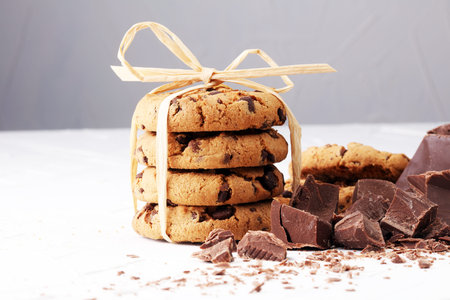 Chocolate cookies on white background with chocolate morsels