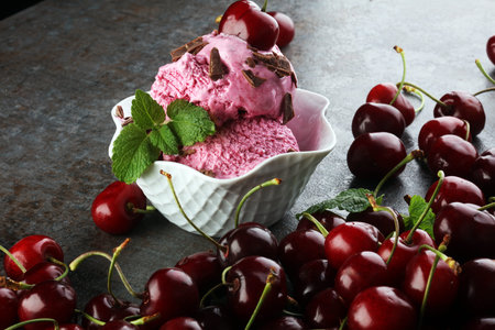 Cherry basket / Sweet cherry background/ cherry with leaf on greyの写真素材