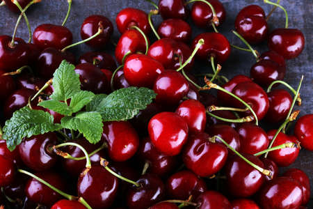 Cherry basket / Sweet cherry background/ cherry with leaf on greyの写真素材