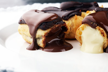 Traditional French dessert. Eclair with chocolate icing. Pastery conceptの写真素材