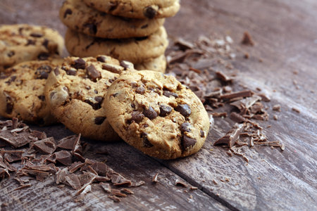 Chocolate cookies on wooden table. Chocolate chip cookies shot