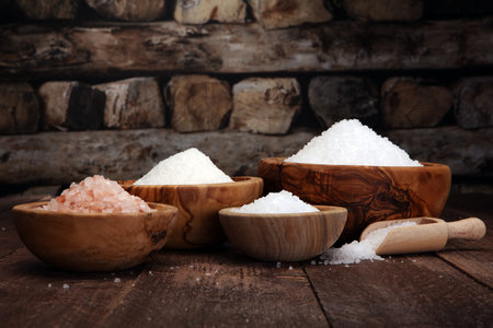 sea salt in bowl. Crystals of salt on tableの写真素材