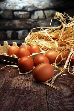 Egg. Fresh farm eggs on a wooden rustic background