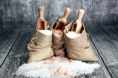 sea salt and himalayan in burlap. Crystals of salt on tableの写真素材