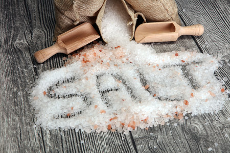 sea salt and himalayan in burlap. Crystals of salt on tableの写真素材