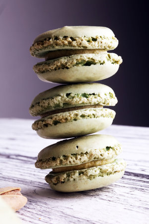 Sweet and colourful french macaroons or macaron with pistachioの写真素材