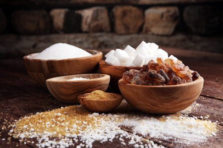 Various types of sugar, brown sugar and whiteの写真素材