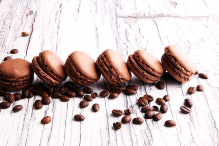 Sweet and colourful french macaroons or macaron with coffee