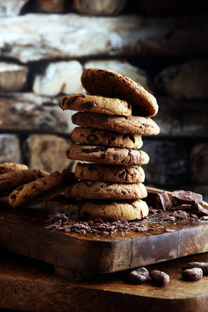 Chocolate cookies on wooden table. Chocolate chip cookiesの写真素材