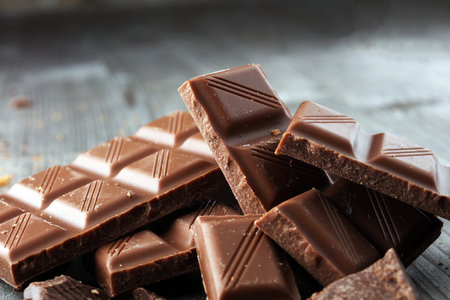 Dark Chocolate chunks and stacked broken chocolate bar.の写真素材