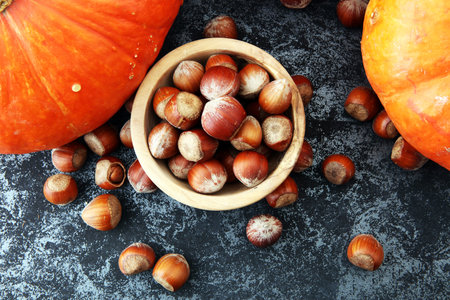 Autumn harvest still life with pumpkins and hazelnuts.の写真素材