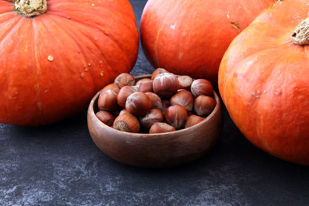 Autumn harvest still life with pumpkins and hazelnuts.の写真素材