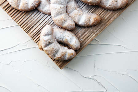 Vanille Kipferl cookies for christmas on brown wood with sugar.の写真素材